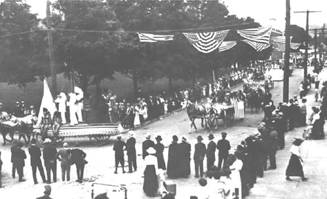 Old Home Week Parade (July 1916) at the corner of Mill and Main Streets